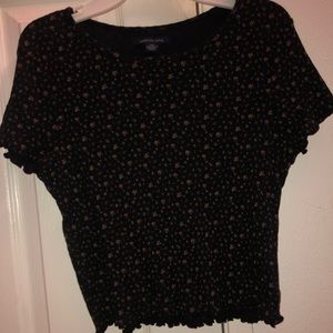 A black floral crop-top from American Eagle.
